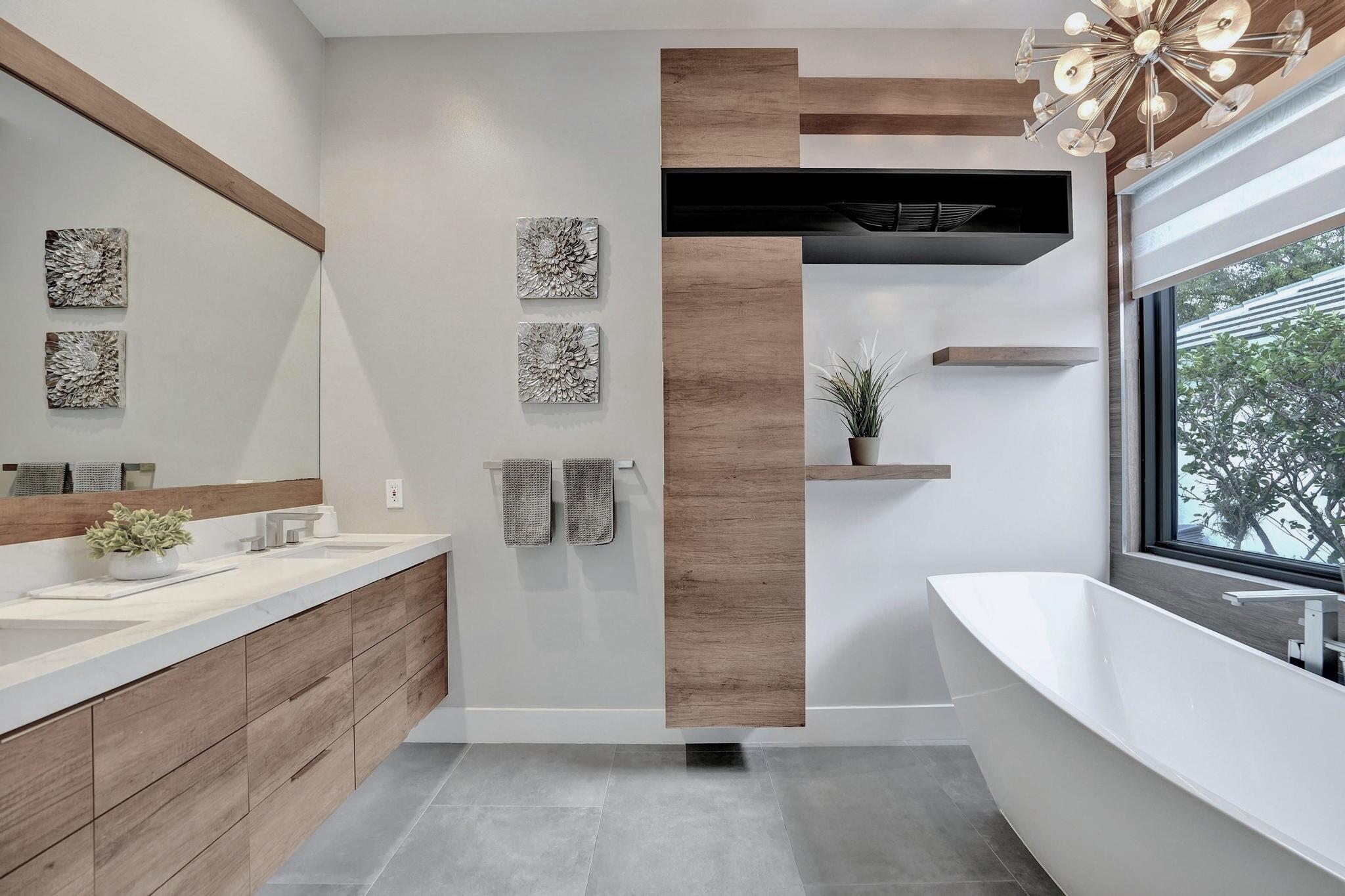 3222 Ridge Trace Davie, FL 33328 - Photo 40 of 77 a spacious bathroom with a double vanity sink a mirror and a bathtub