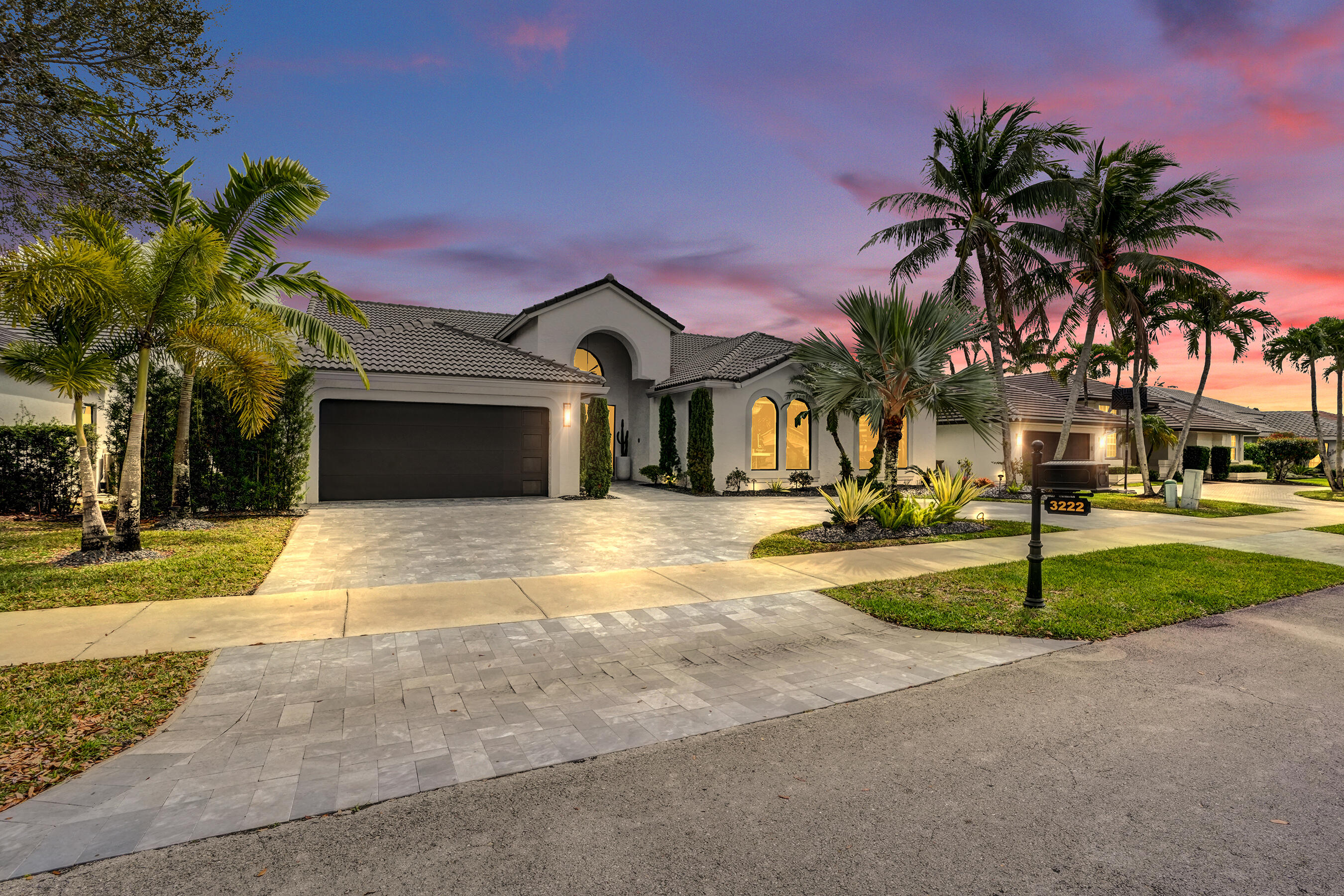 3222 Ridge Trace Davie, FL 33328 - Photo 4 of 77 a front view of a house with a yard and garage