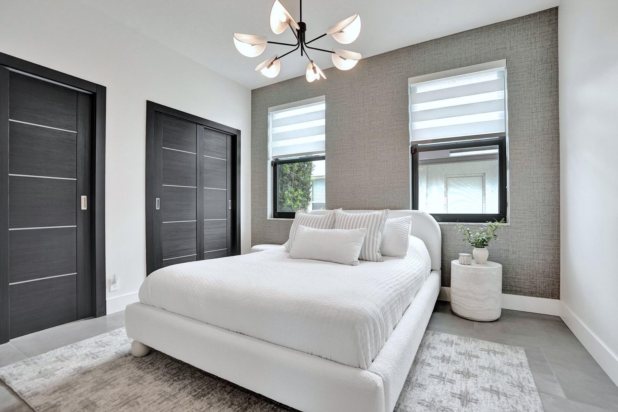 3222 Ridge Trace Davie, FL 33328 - Photo 48 of 77 a bedroom with a bed and a window