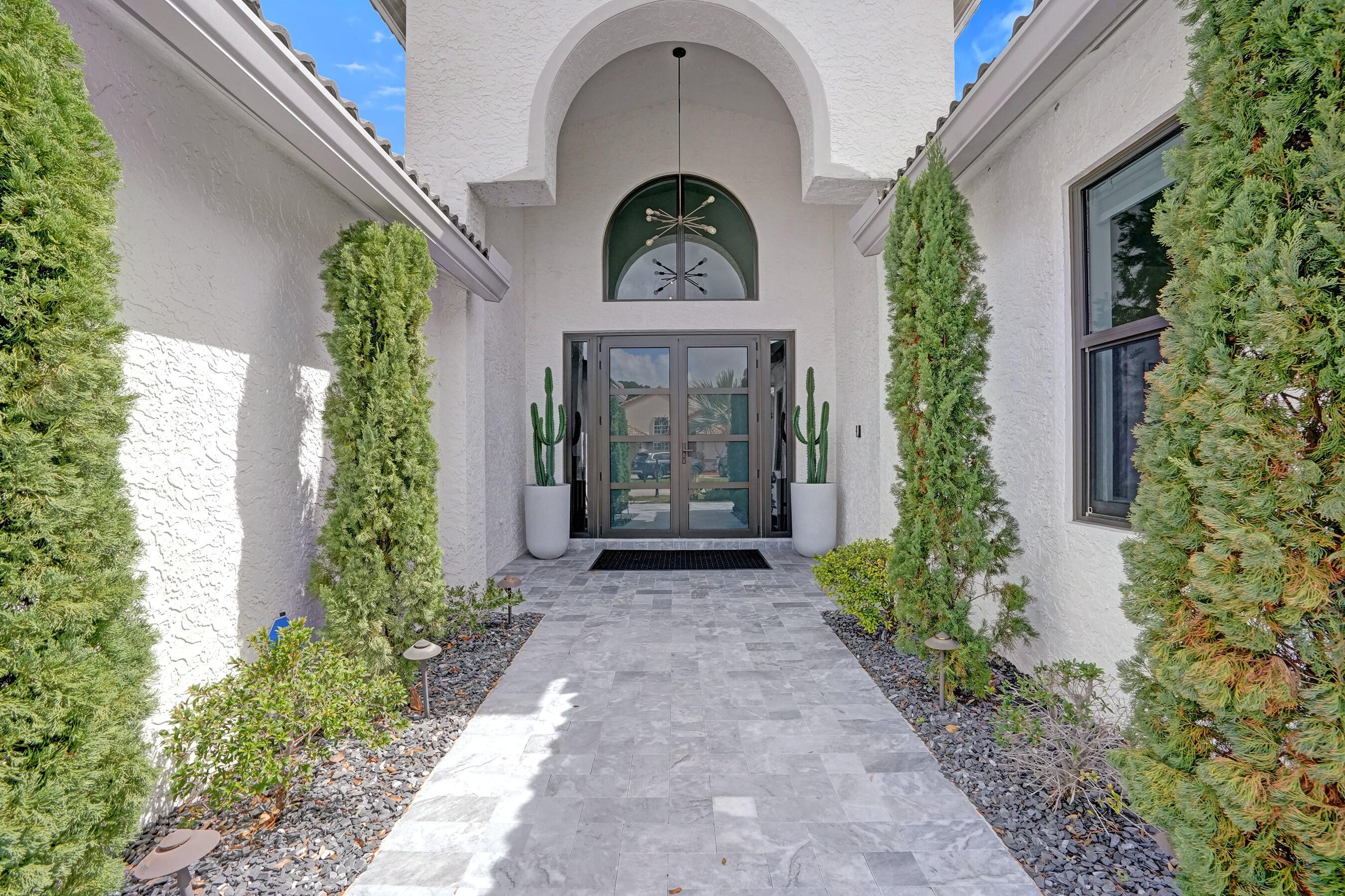 3222 Ridge Trace Davie, FL 33328 - Photo 5 of 77 a front view of a house with garden