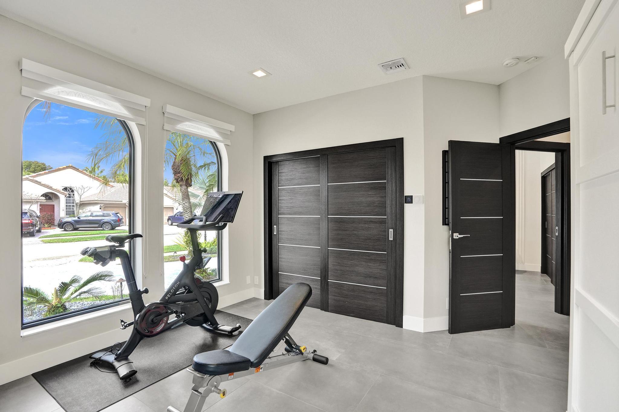 3222 Ridge Trace Davie, FL 33328 - Photo 52 of 77 a view of a room with gym equipment and windows
