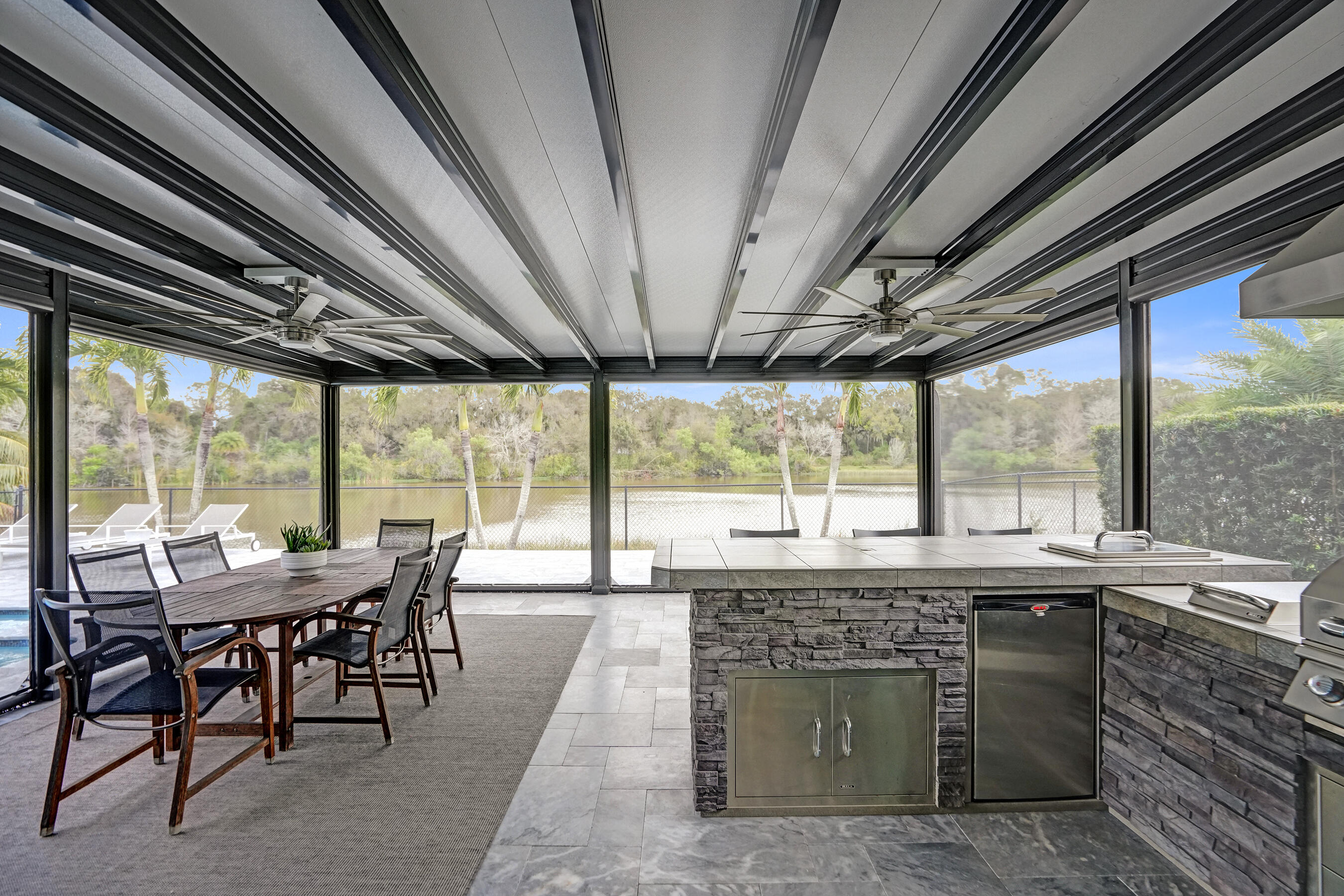 3222 Ridge Trace Davie, FL 33328 - Photo 56 of 77 a view of a dining room with furniture large windows and wooden floor