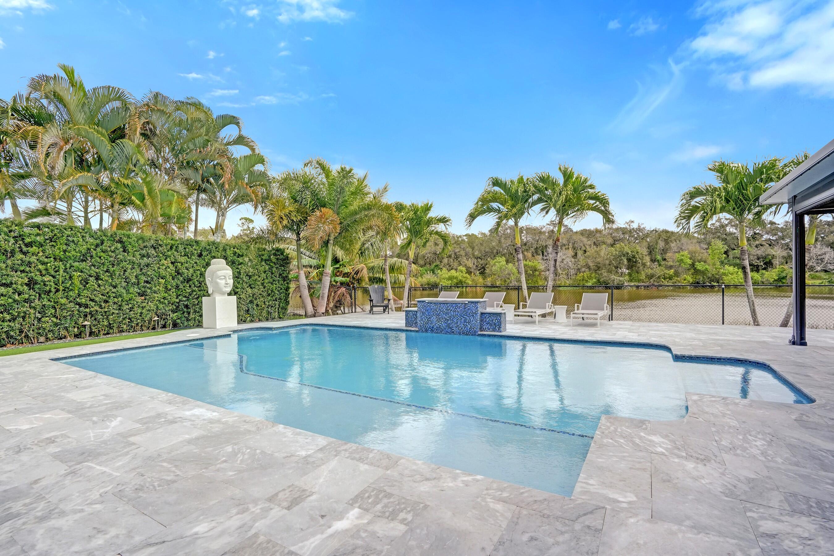 3222 Ridge Trace Davie, FL 33328 - Photo 65 of 77 a view of a swimming pool with an outdoor space and seating area