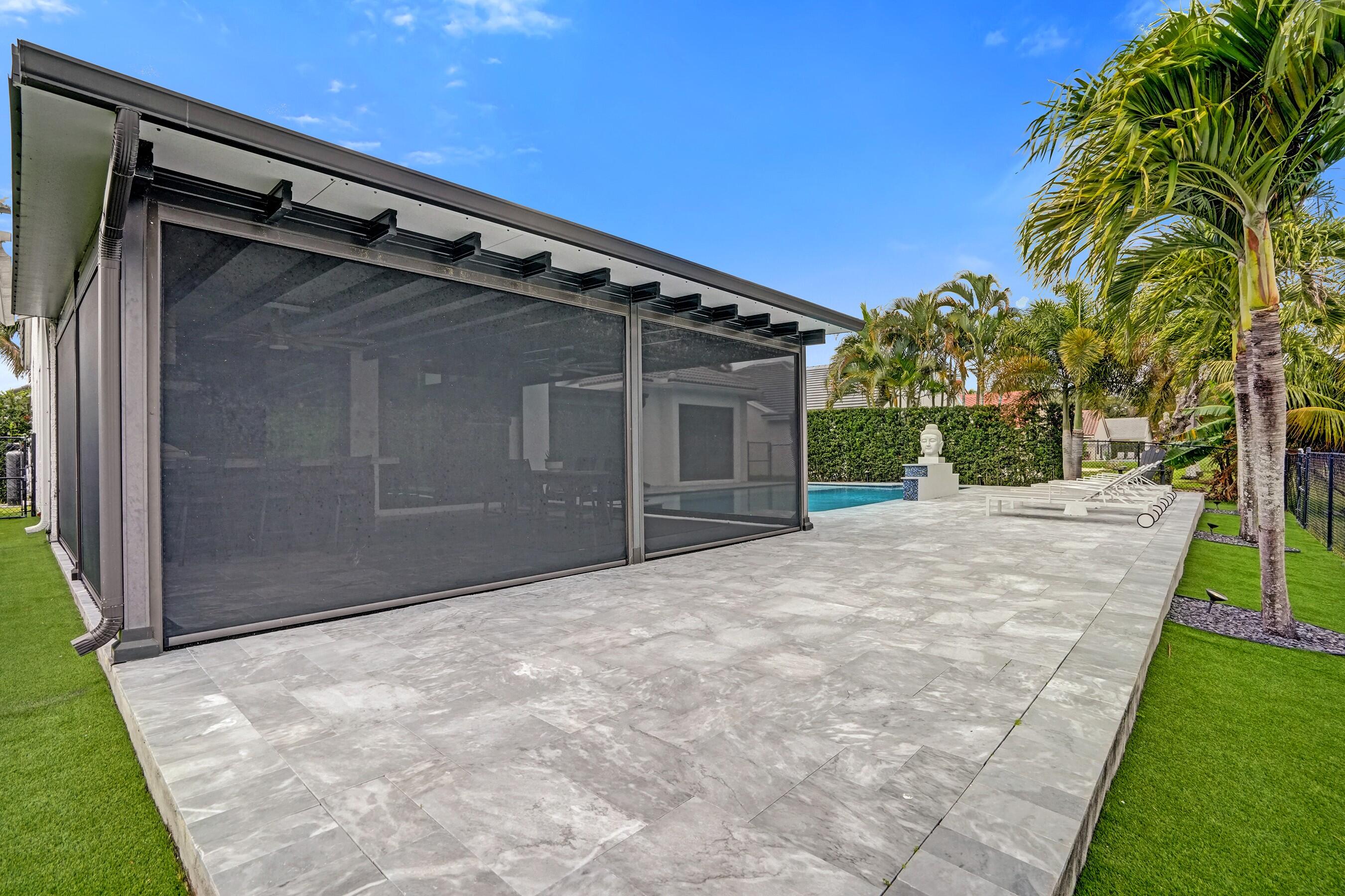 3222 Ridge Trace Davie, FL 33328 - Photo 70 of 77 a backyard of a house with fountain and garden