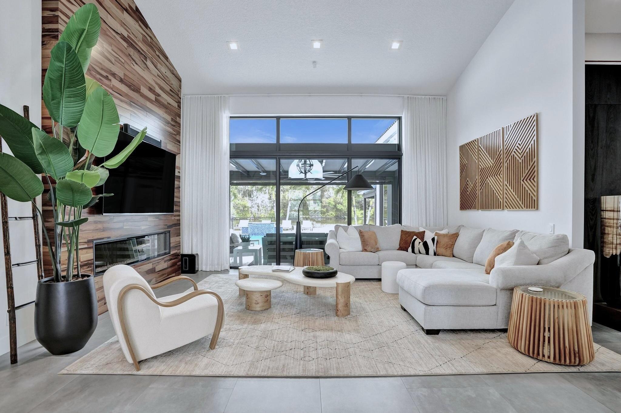 3222 Ridge Trace Davie, FL 33328 - Photo 7 of 77 a living room with furniture fireplace and a large window
