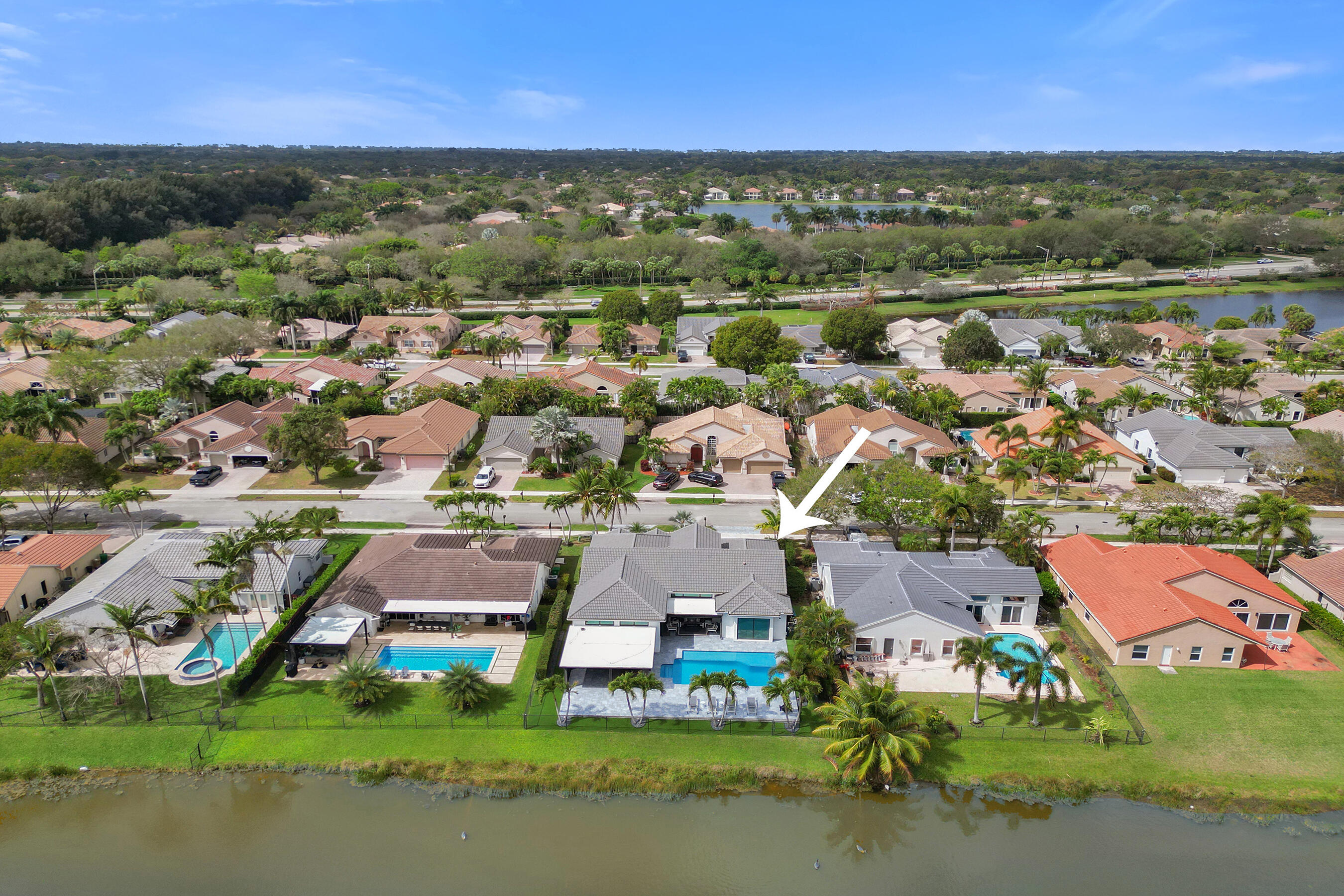 3222 Ridge Trace Davie, FL 33328 - Photo 72 of 77 an aerial view of residential houses with outdoor space and lake view