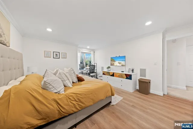 a bed room with a bed and furniture