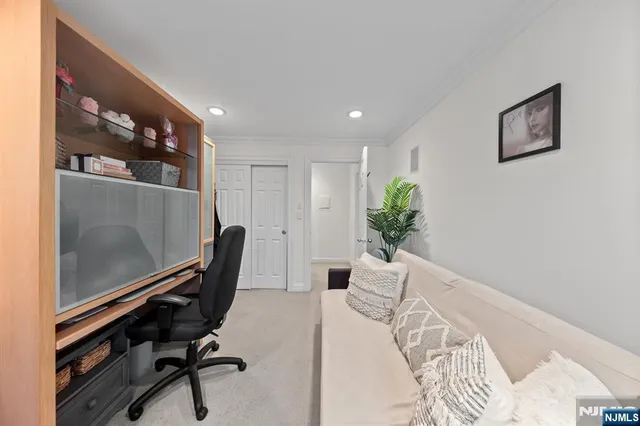 a bathroom with a sink a toilet a mirror and vanity