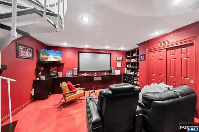 a living room with furniture a rug and a flat screen tv