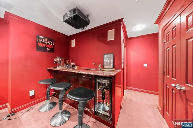 a bathroom with a sink a toilet a mirror and shower