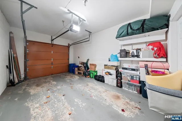 a front view of a house with a yard and mountain view