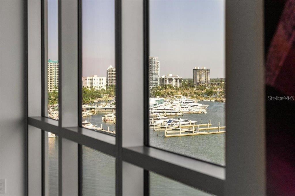 111 Golden Gate Point, Unit 802PH Sarasota, FL 34236 - Photo 34 of 55 a view of a glass door with a window