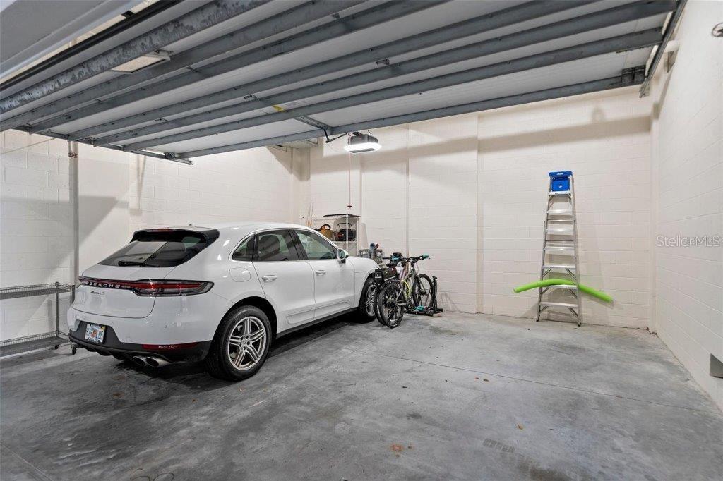 111 Golden Gate Point, Unit 802PH Sarasota, FL 34236 - Photo 49 of 55 a view of a car in garage