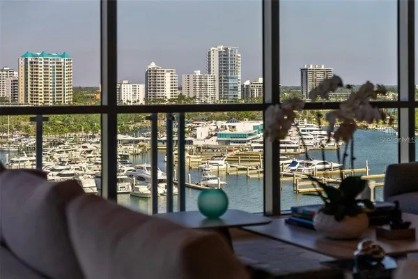 a outdoor dining space with furniture and city view