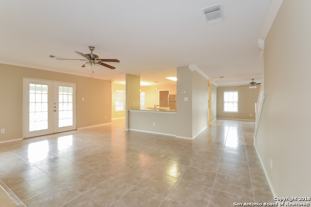 8423 Manderly Place Converse, TX 78109 - Photo 3 of 10 a view of an empty room with a window and wooden floor