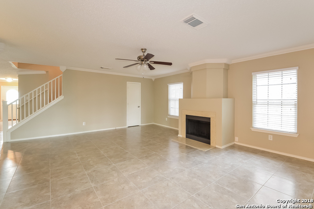 8423 Manderly Place Converse, TX 78109 - Photo 4 of 10 a view of a livingroom with a fireplace and window