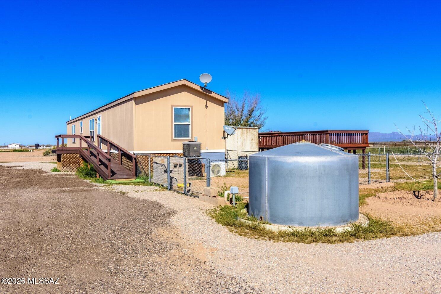 8845 Ghost Ranch Road Marana, AZ 85653 - Photo 39 of 39 Side of house with water tank