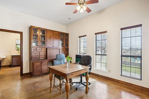 a workspace with furniture and window