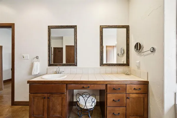 a bathroom with a sink and a mirror