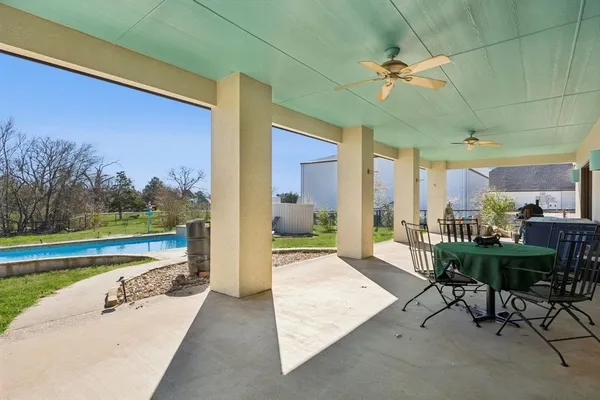 a view of a swimming pool and lounge chair