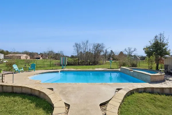 a view of a swimming pool and lake view