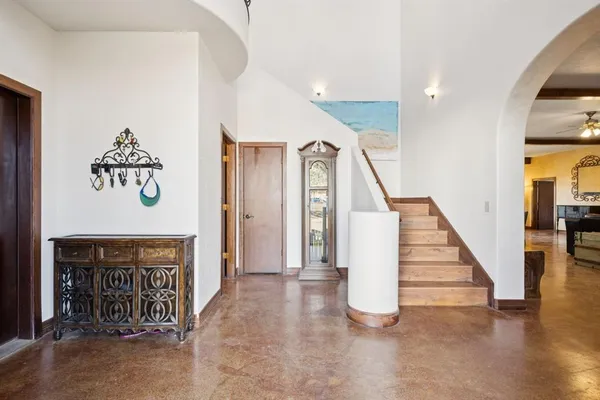 a view of entryway with stairs and wooden floor