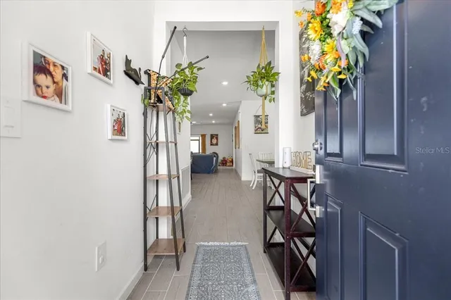 a view of entryway with wooden floor