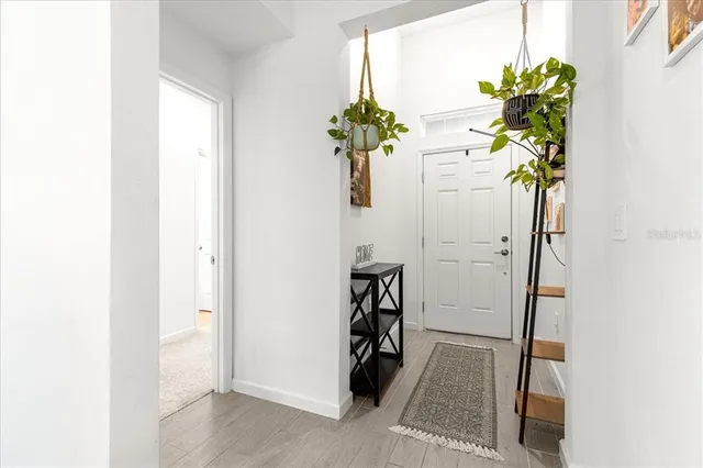 a view of hallway with paintings on the wall