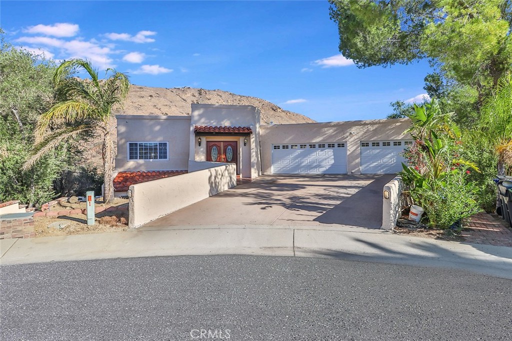 72 Hackamore Lane Bell Canyon, CA 91307 - Photo 1 of 1 a view of a house with a road and a yard