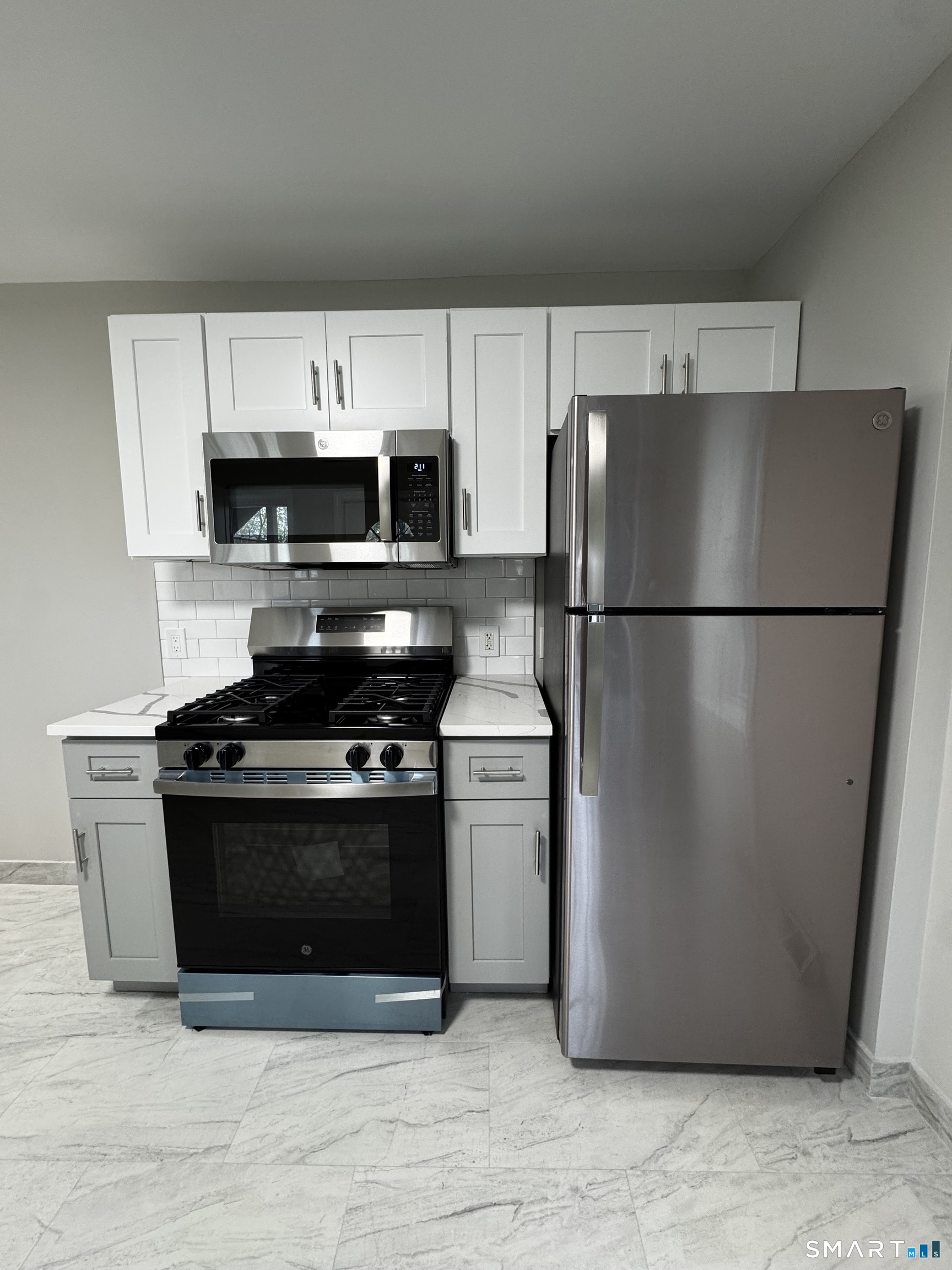45-51 Cowles Street, Unit 45 Bridgeport, CT 06607 - Photo 7 of 33 completely renovated kitchen, with new cabinets, counter tops, appliances, floors, lighting and paint