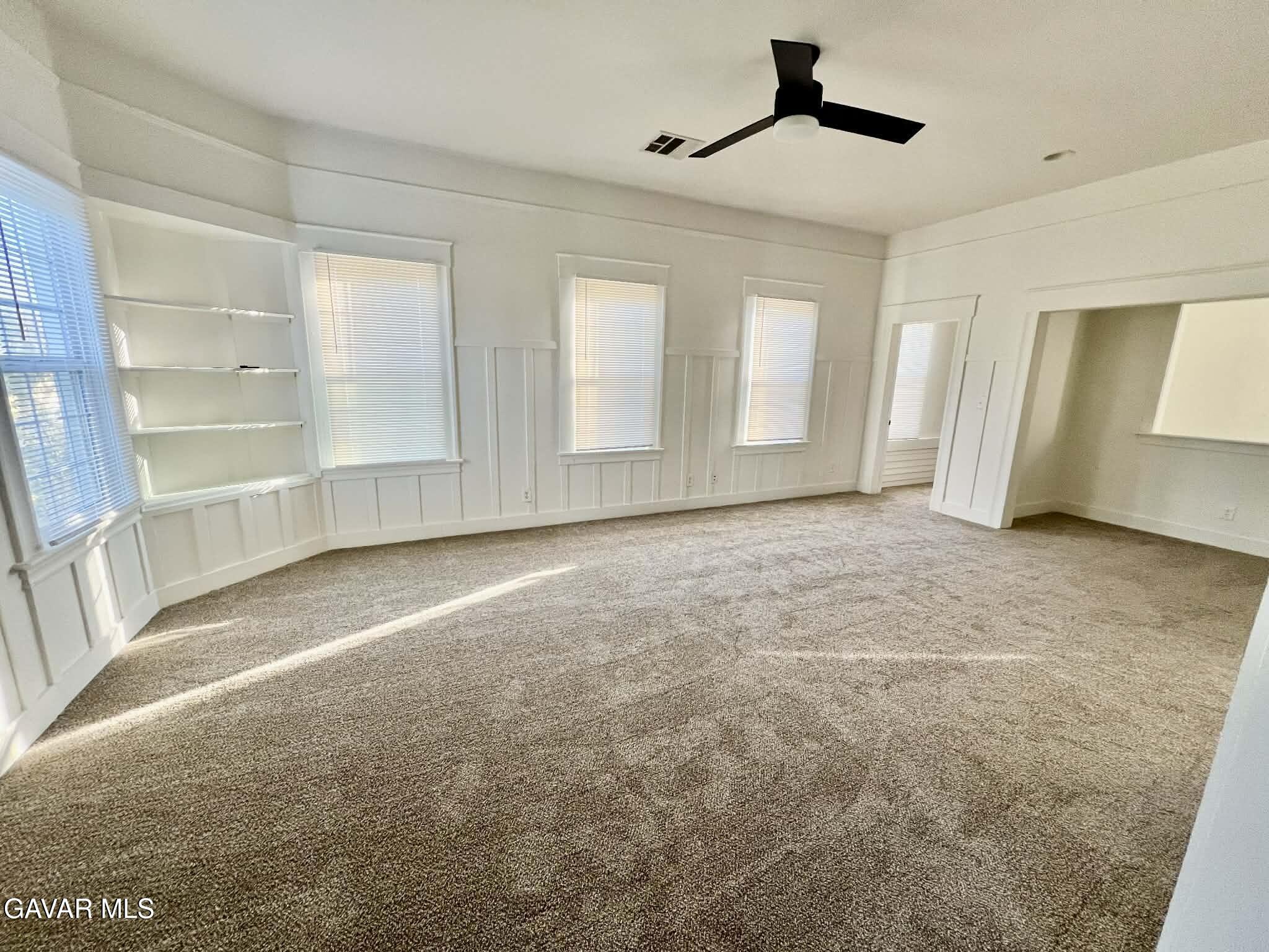 2702 19th Street Bakersfield, CA 93301 - Photo 6 of 21 an empty room with windows and cabinet