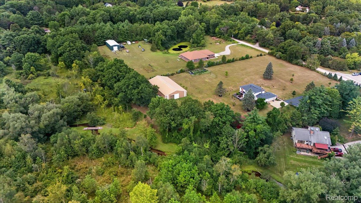 7330 West Gates Street Romeo, MI 48065 - Photo 66 of 73 Expansive property featuring multiple structures, mature trees, and a pond