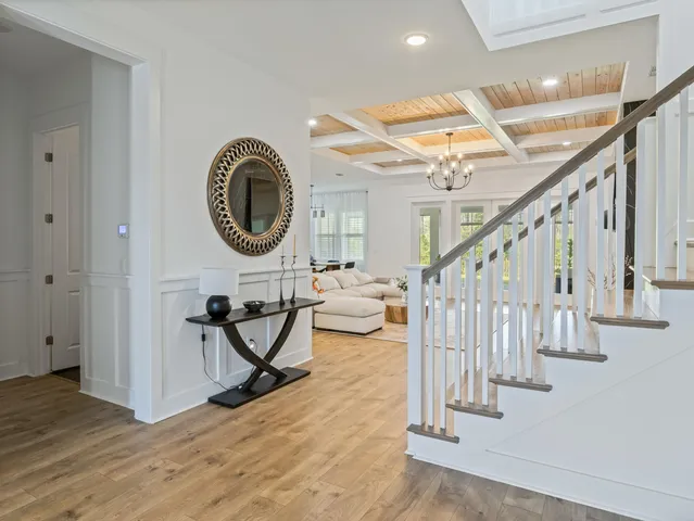 a view of an entryway with wooden floor and a sink