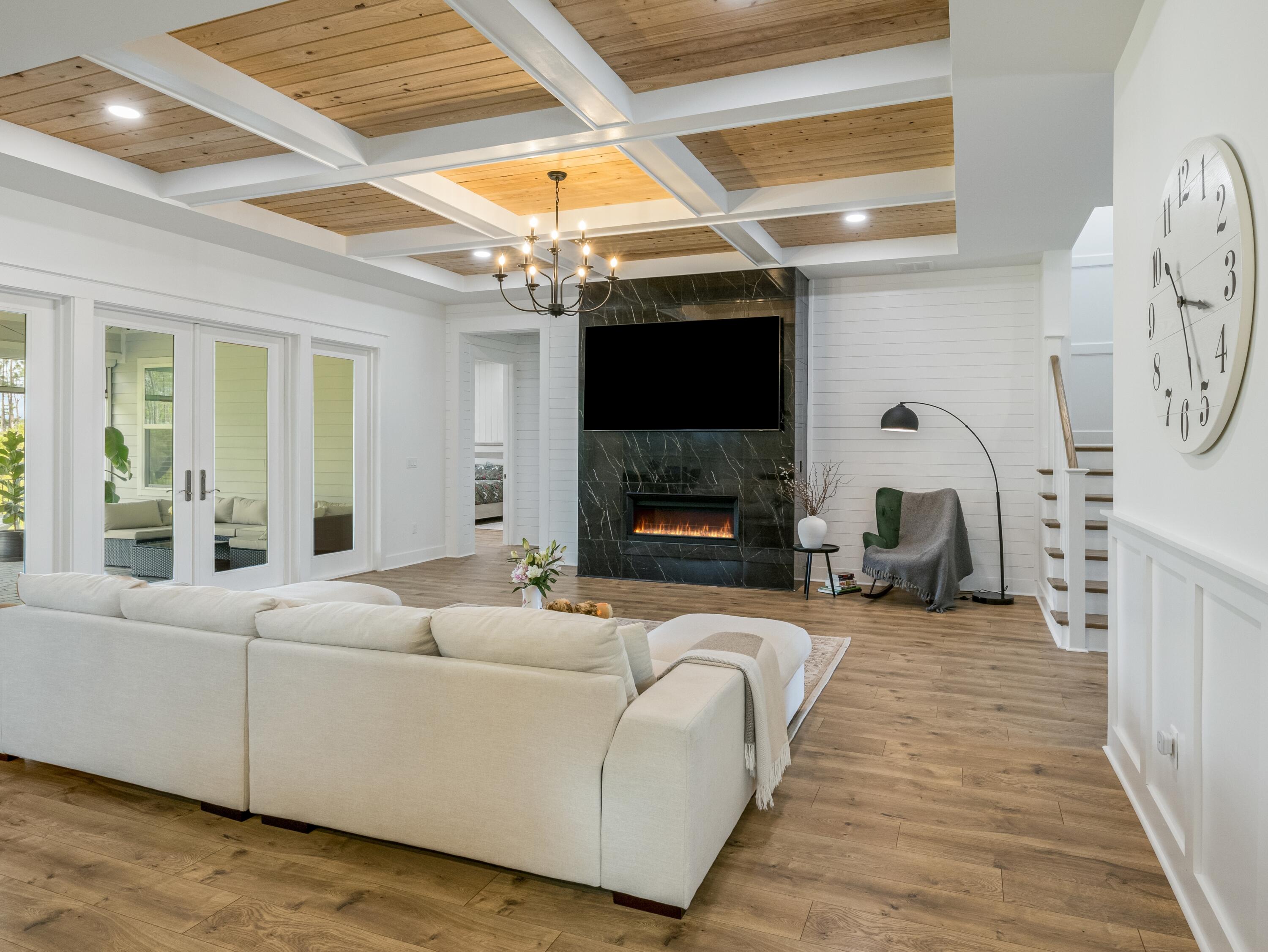 298 Lafayette Road Watersound, FL 32461 - Photo 13 of 76 a living room with furniture a fireplace and a flat screen tv