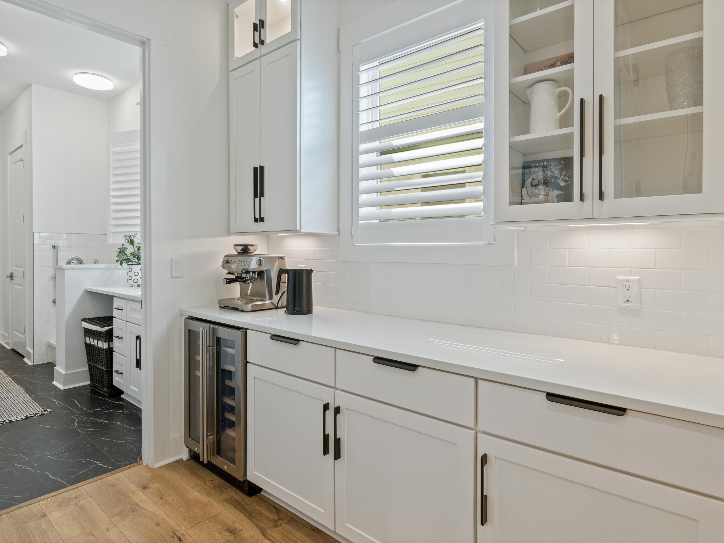 298 Lafayette Road Watersound, FL 32461 - Photo 21 of 76 a kitchen with a sink and a window