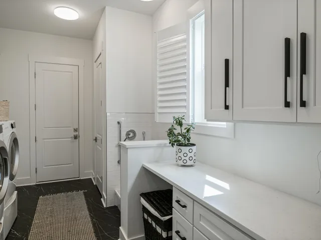 a view of a workspace with furniture and wooden floor