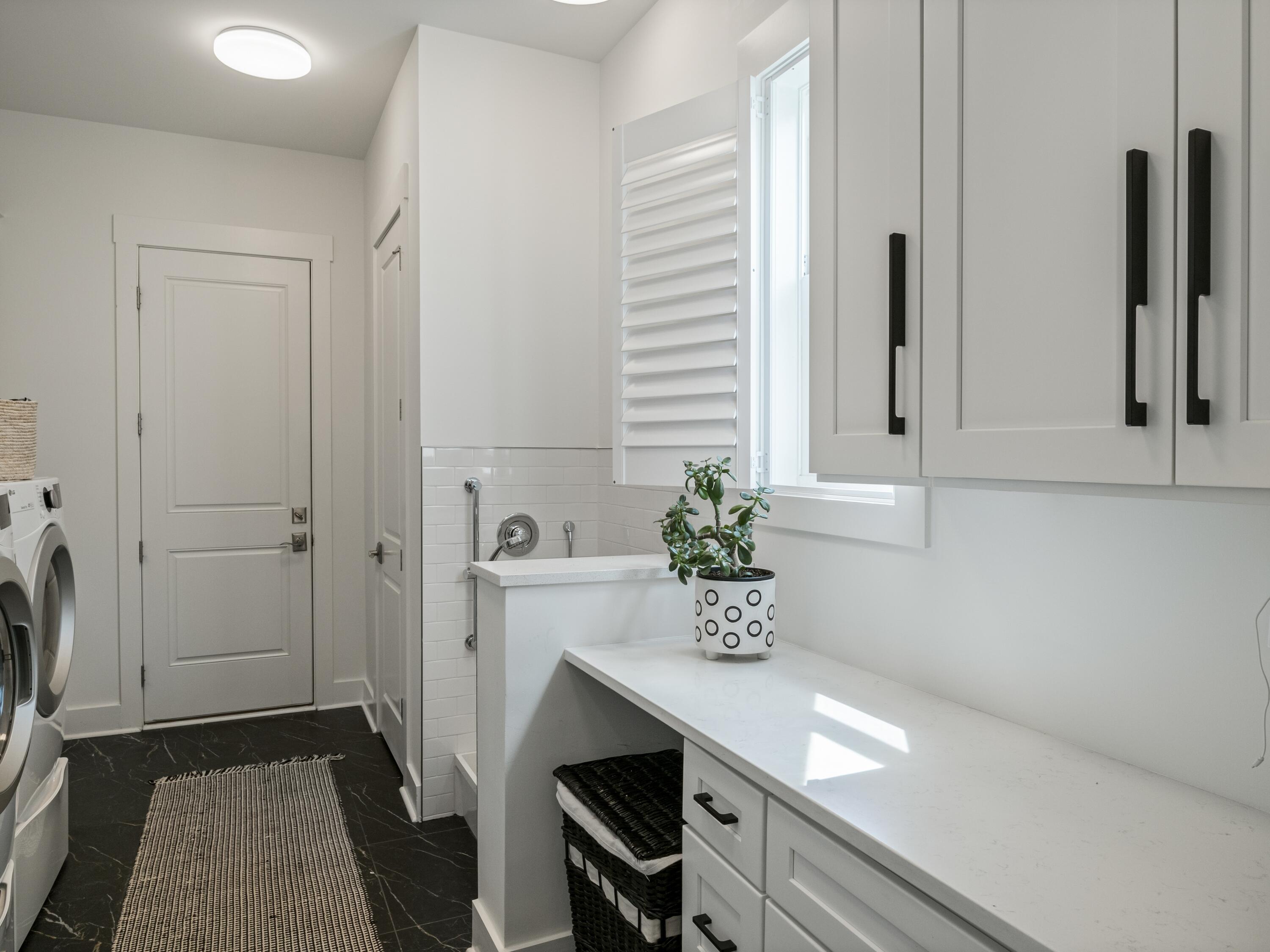 298 Lafayette Road Watersound, FL 32461 - Photo 27 of 76 a room with a table and potted plant