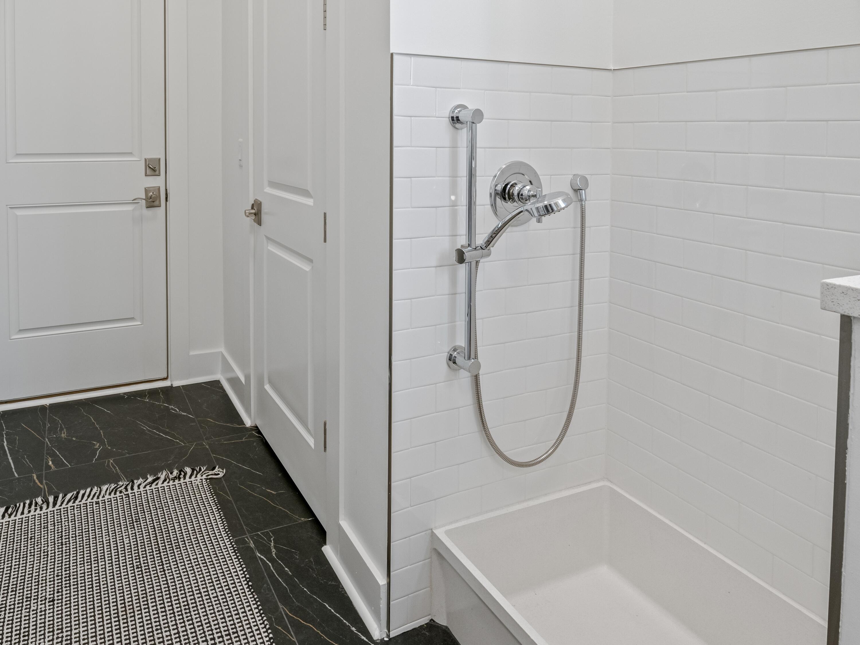 298 Lafayette Road Watersound, FL 32461 - Photo 28 of 76 a bathroom with a bath tub and a shower