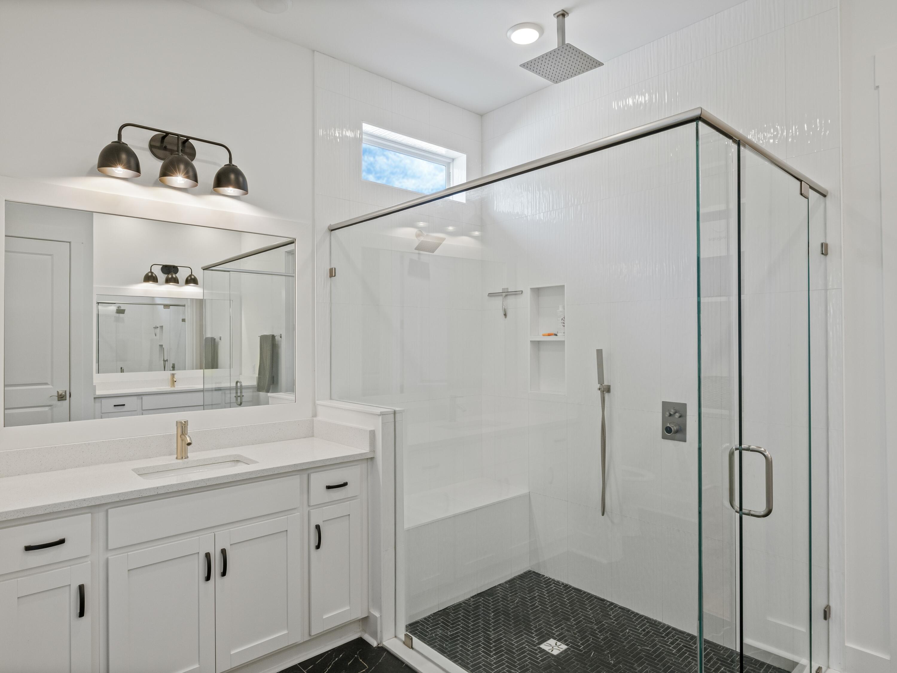 298 Lafayette Road Watersound, FL 32461 - Photo 34 of 76 a bathroom with a sink a shower and a mirror