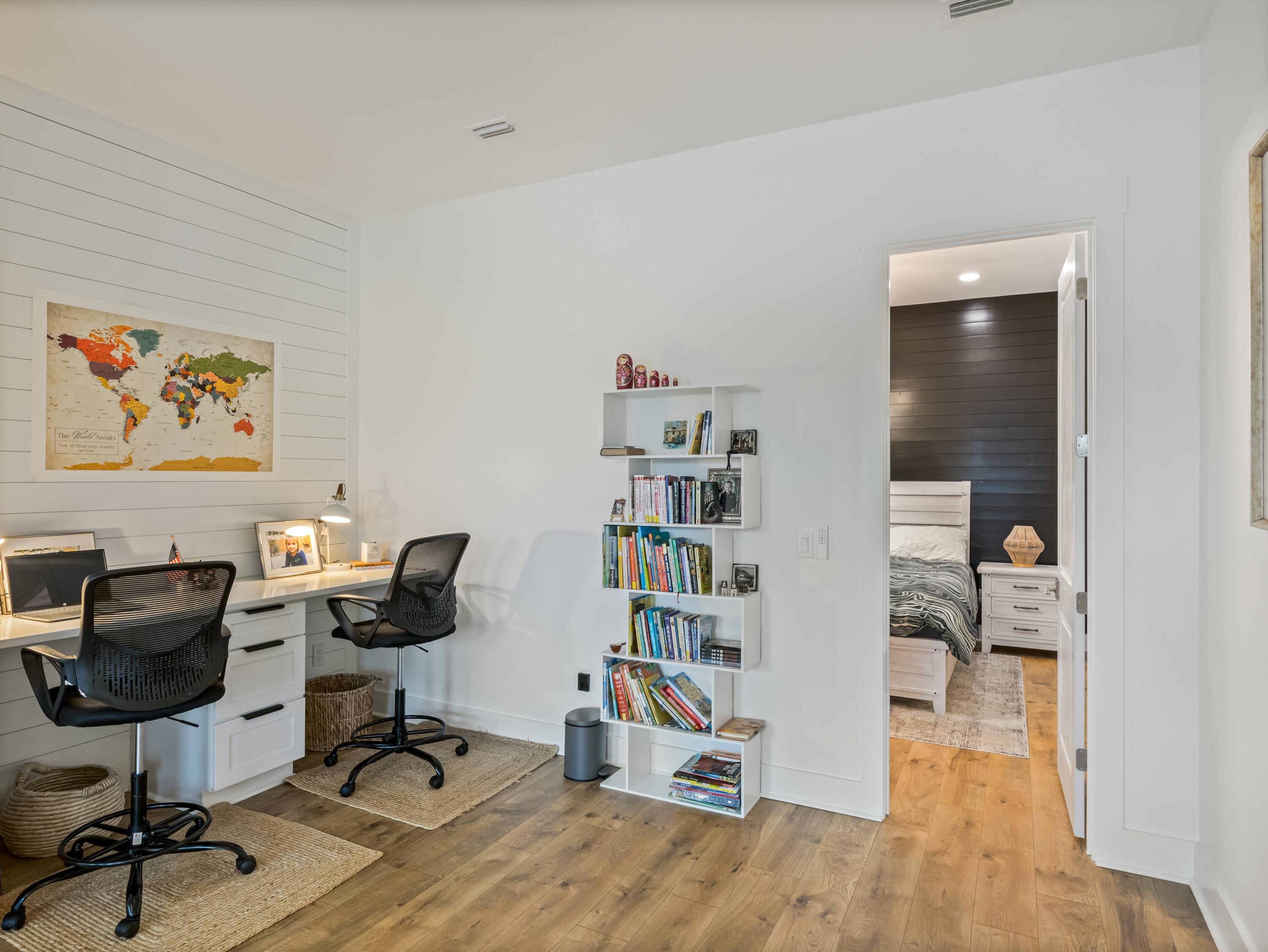 298 Lafayette Road Watersound, FL 32461 - Photo 40 of 76 a view of a workspace with furniture and wooden floor