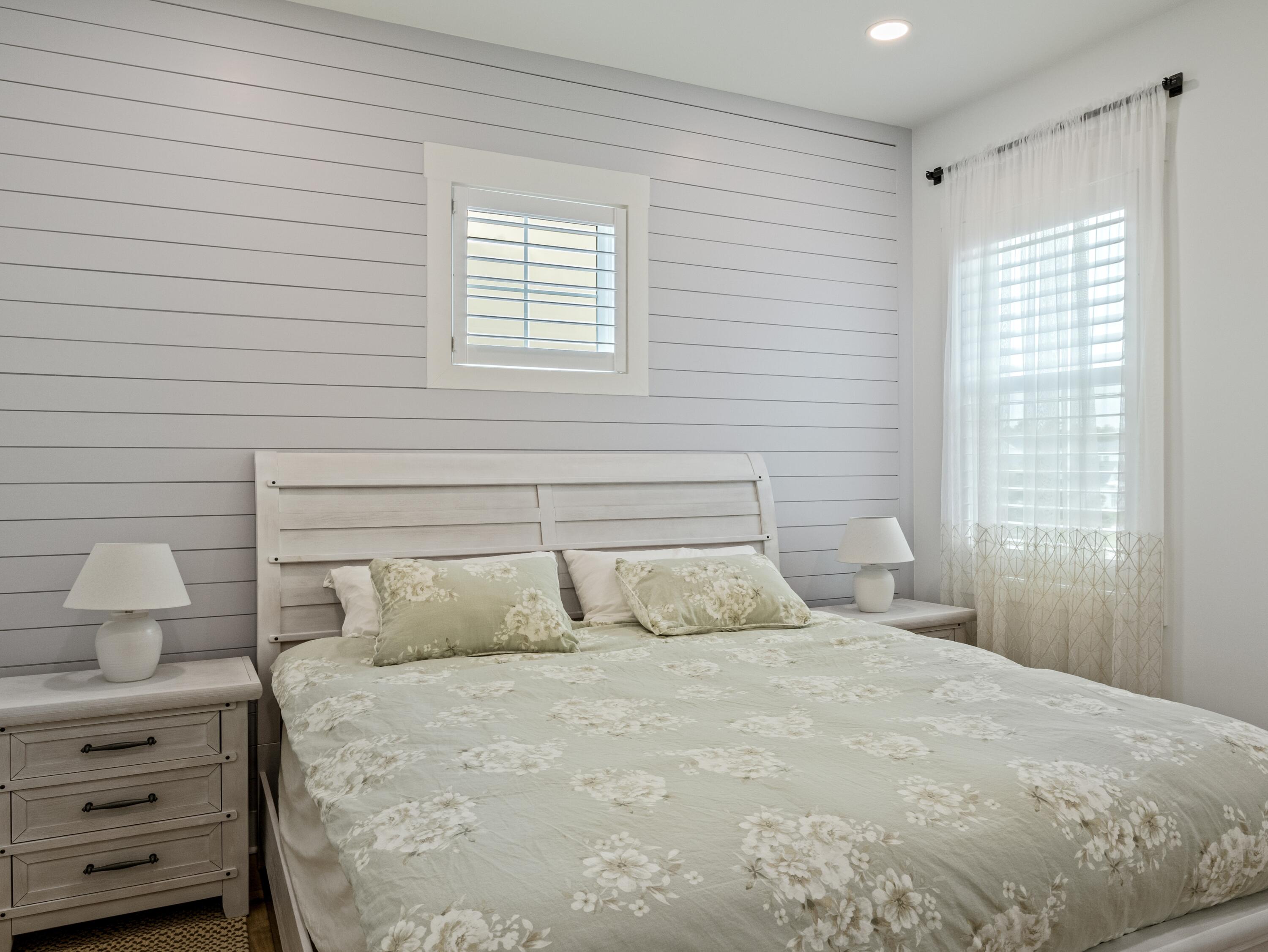 298 Lafayette Road Watersound, FL 32461 - Photo 48 of 76 a bedroom with a bed and window