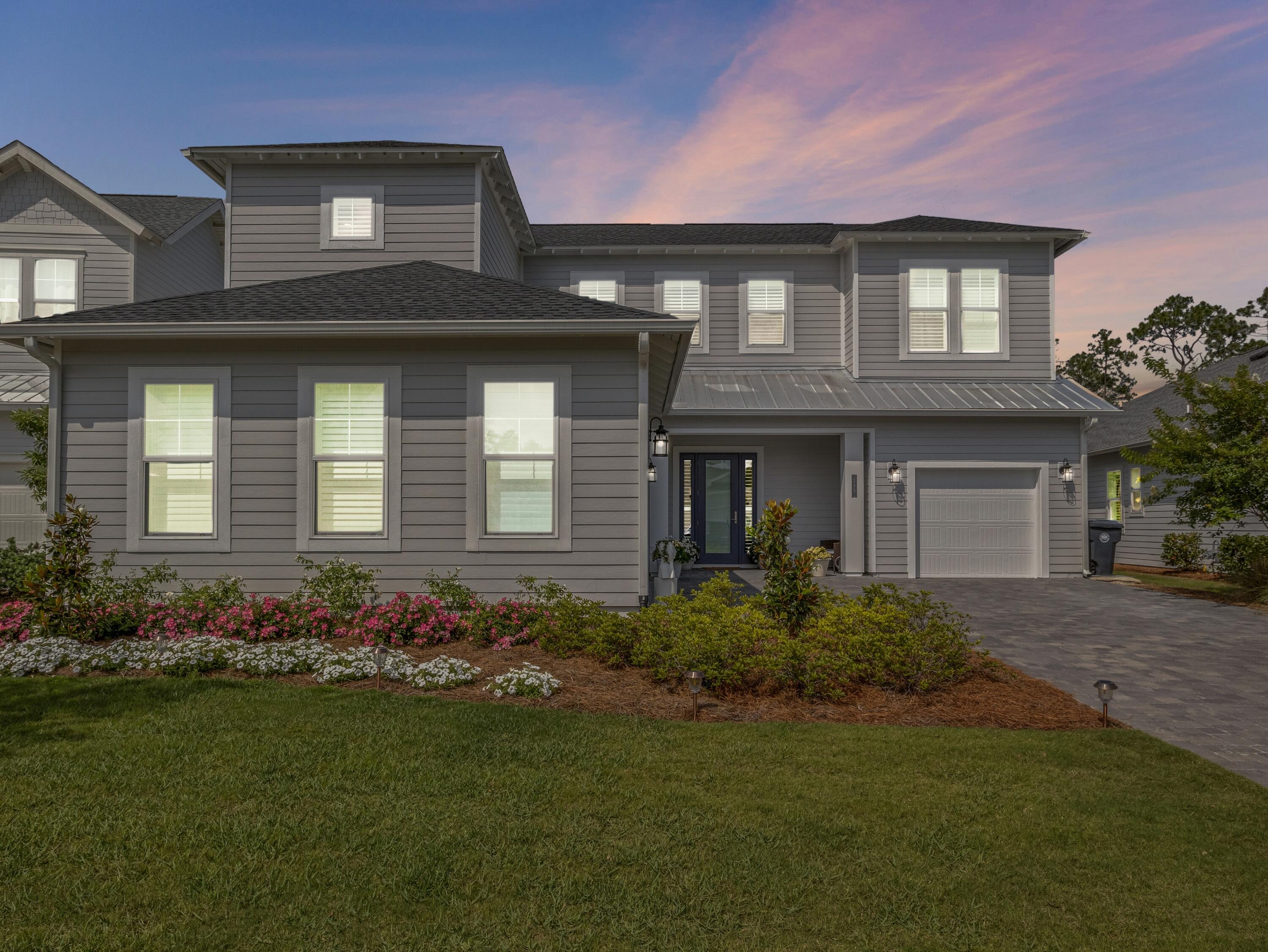 298 Lafayette Road Watersound, FL 32461 - Photo 71 of 76 a front view of a house with a garden