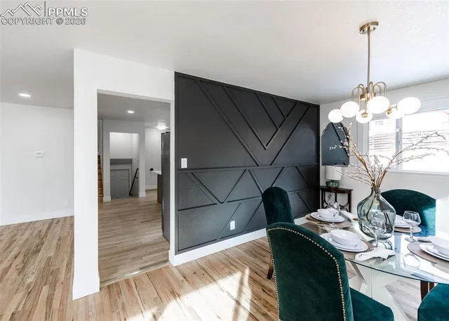 a kitchen with kitchen island a sink stainless steel appliances and cabinets