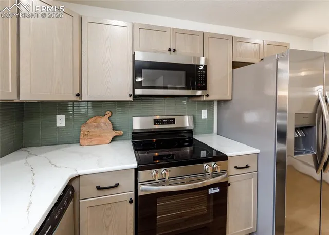 a kitchen with a stove and a microwave