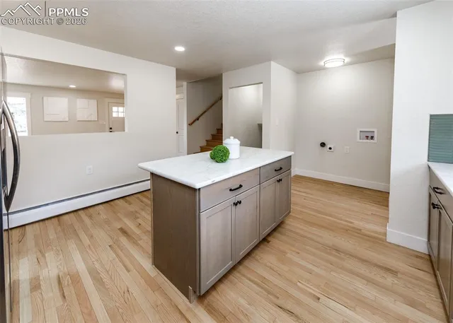 a bathroom with a sink and mirror