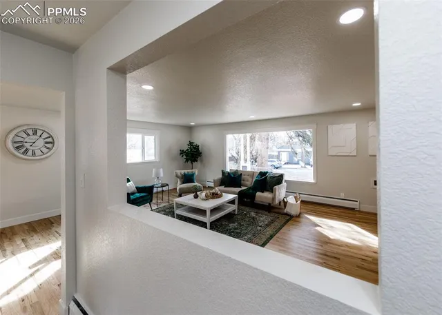 a living room with furniture and a window