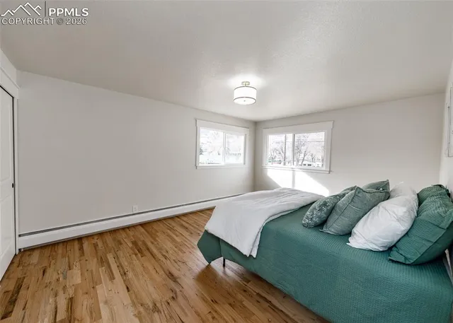 a bedroom with a bed and window