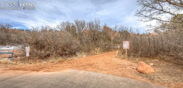 a view of a yard covered with snow in a yard