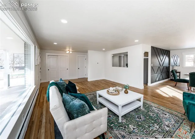 a living room with furniture and a rug