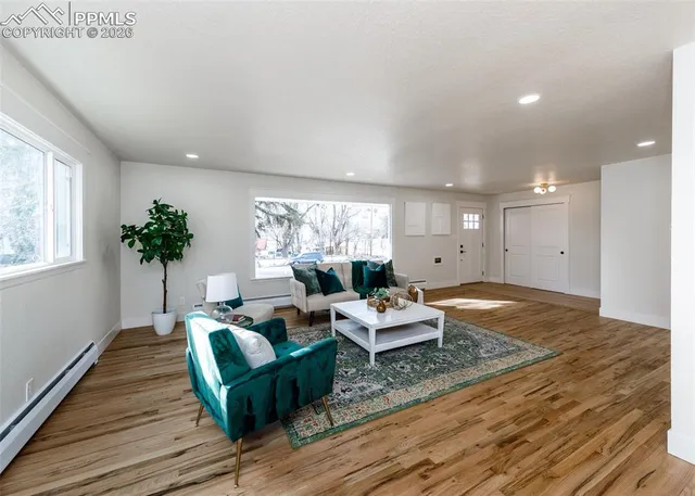 a living room with furniture and a large window